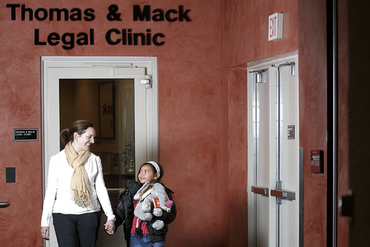 Woman and child exiting legal clinic