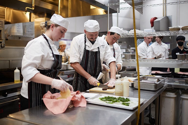 Students working in a kitchen