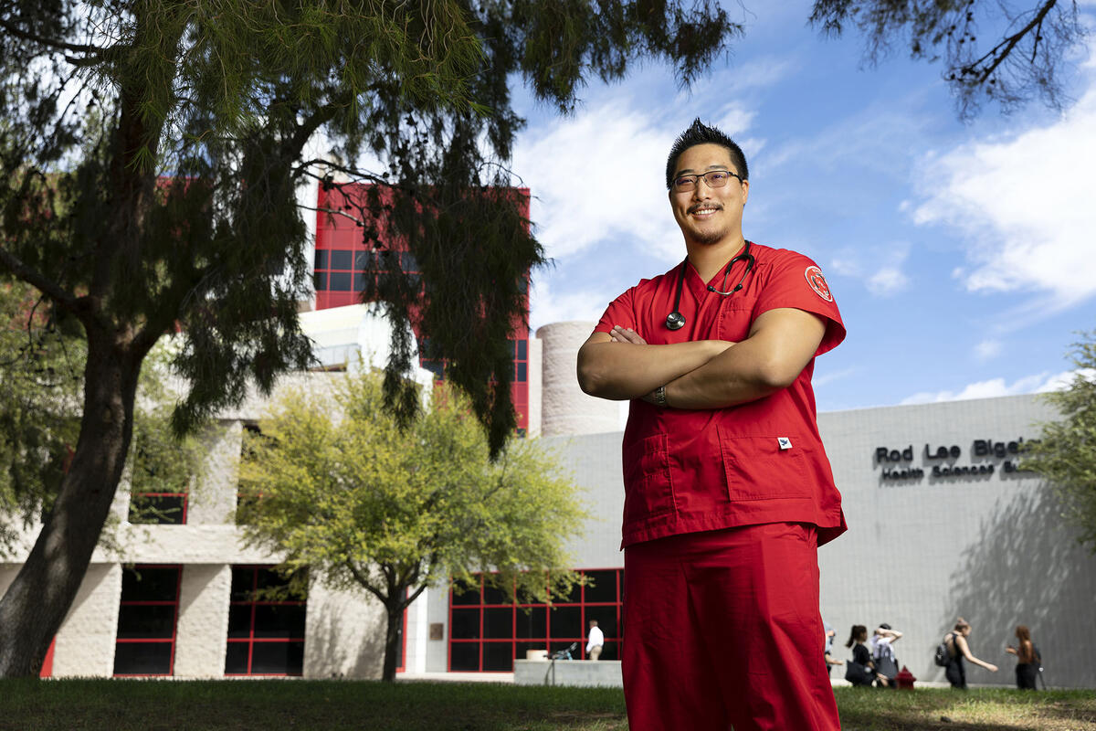 Student in red scrubs