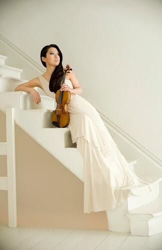 Sarah Chang sits on staircase with violen