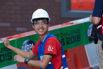 Donghyn Ahn gives an approving grin as Metal Rebel completes the task.