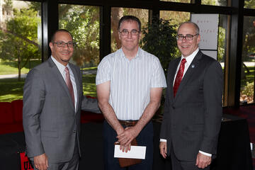 Provost John Valery White; Educational Outreach Faculty Excellence Award winner Ed Nagelhout; and President Neal Smatresk.