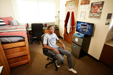 Tre Williams could have commuted from his family's Las Vegas home. Instead, the freshman computer science major, set up shop on campus at Dayton North where he keeps his Playstation primed for late-night gaming.