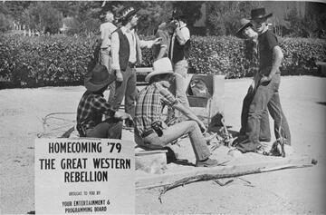 Students in cowboy shirts and hats fit in with the theme of 1979 homecoming: The Great Western Rebellion. Other events during Homecoming Week that year included a lasso rope contest, square dance lessons, horseshoes, and a covered wagon race.