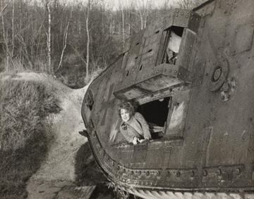 black and white photo of clara bow looking out a tank window
