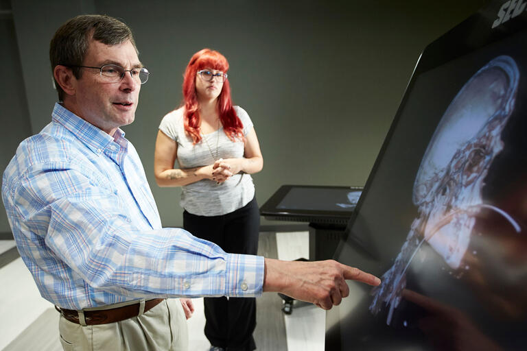 Jeff Fahl examines an x-ray