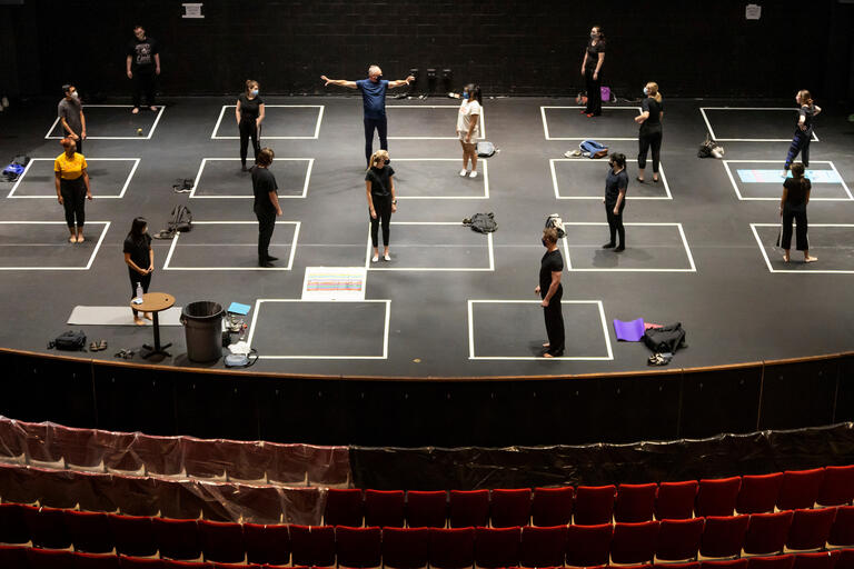 Theater students practice on stage