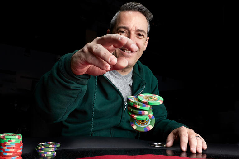 Perry Friedman holds poker chips