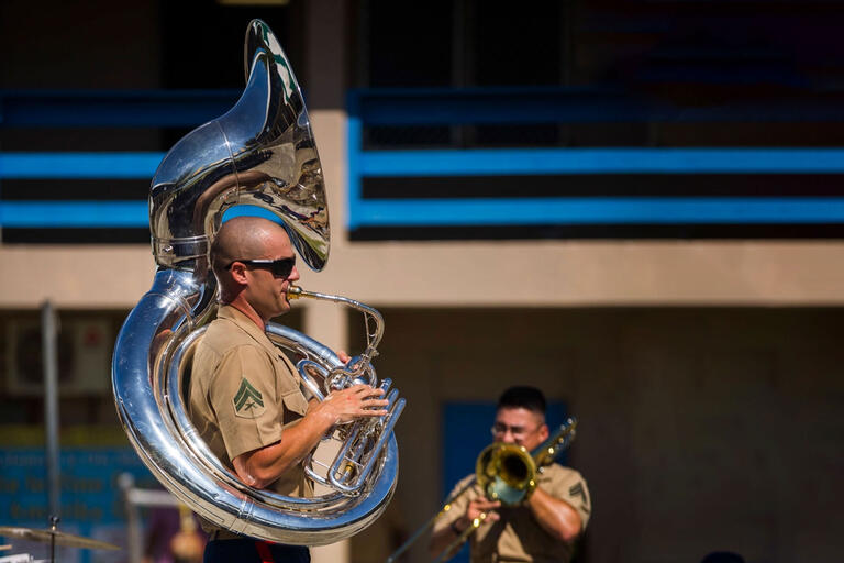 marine playing a tuba in military band