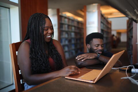 image of two students smiling at the lied library