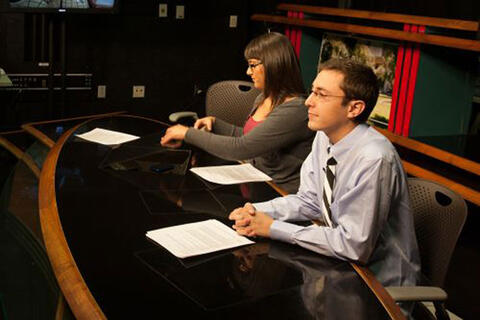 Students working at an anchor desk.