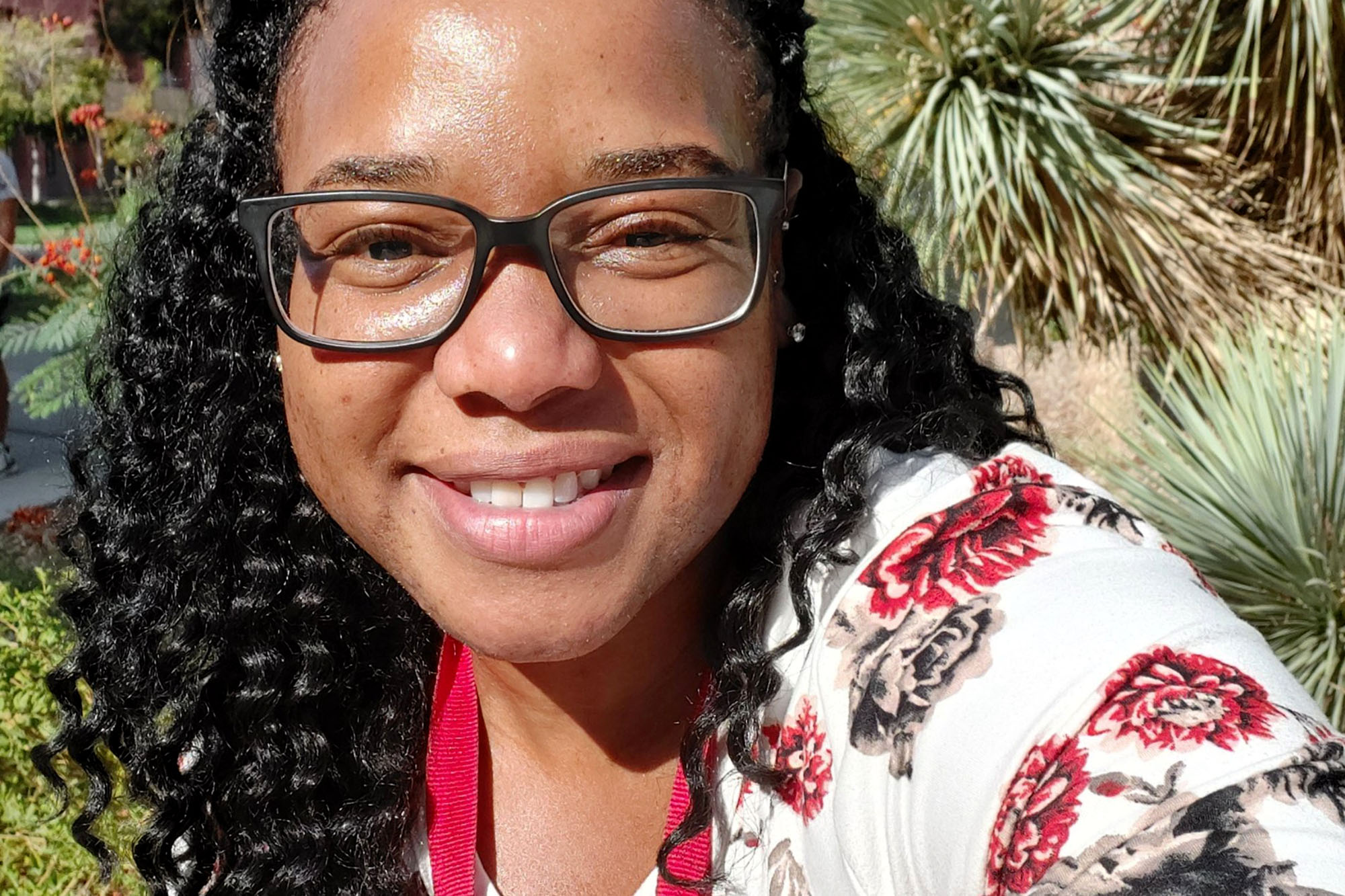 woman pictured in front of plants
