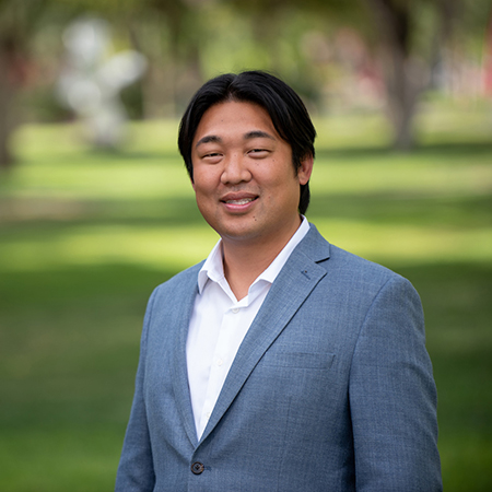 man wearing a greyish blue suit 