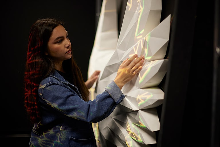 Student working with sculpture