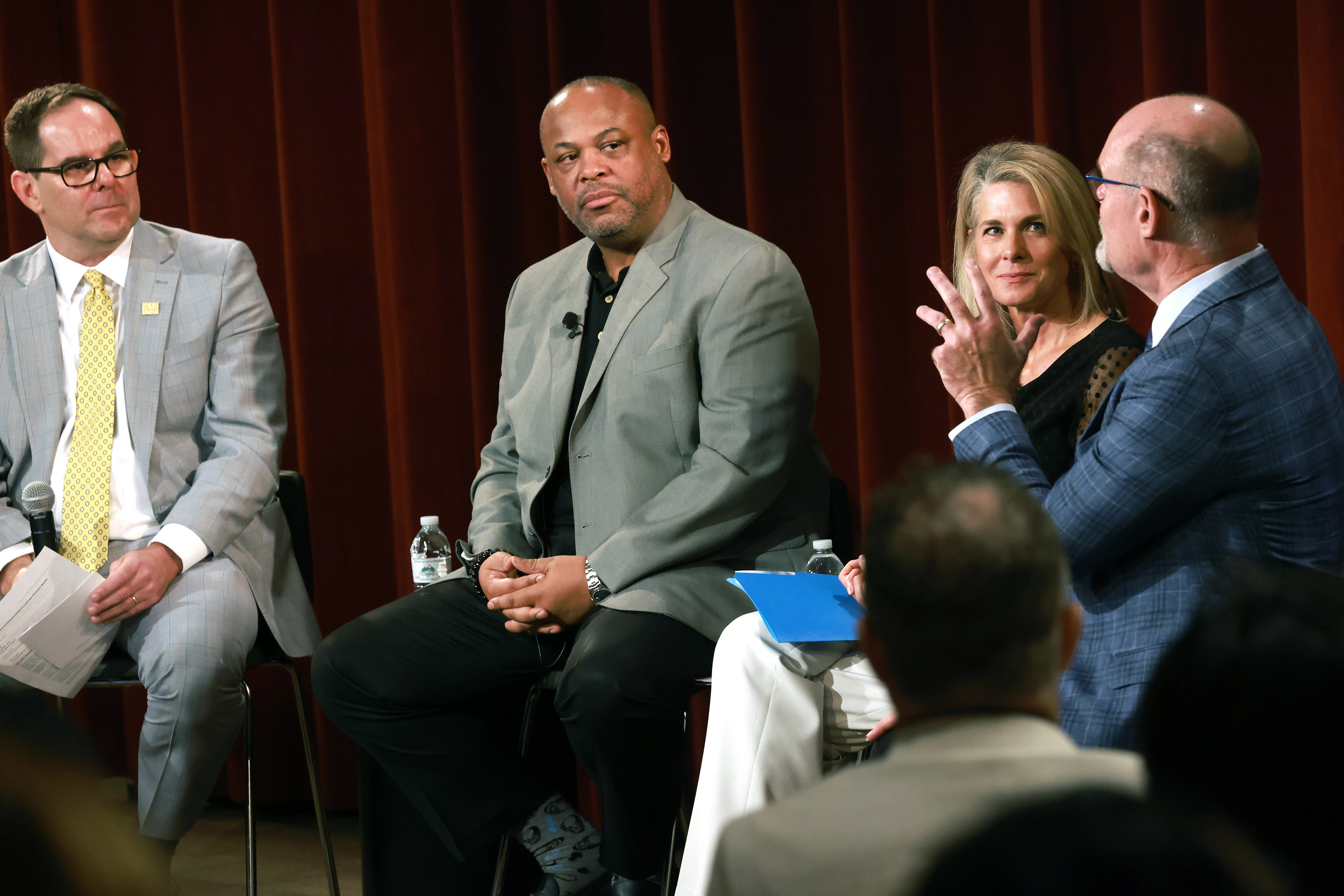 A panel of people having a conversation