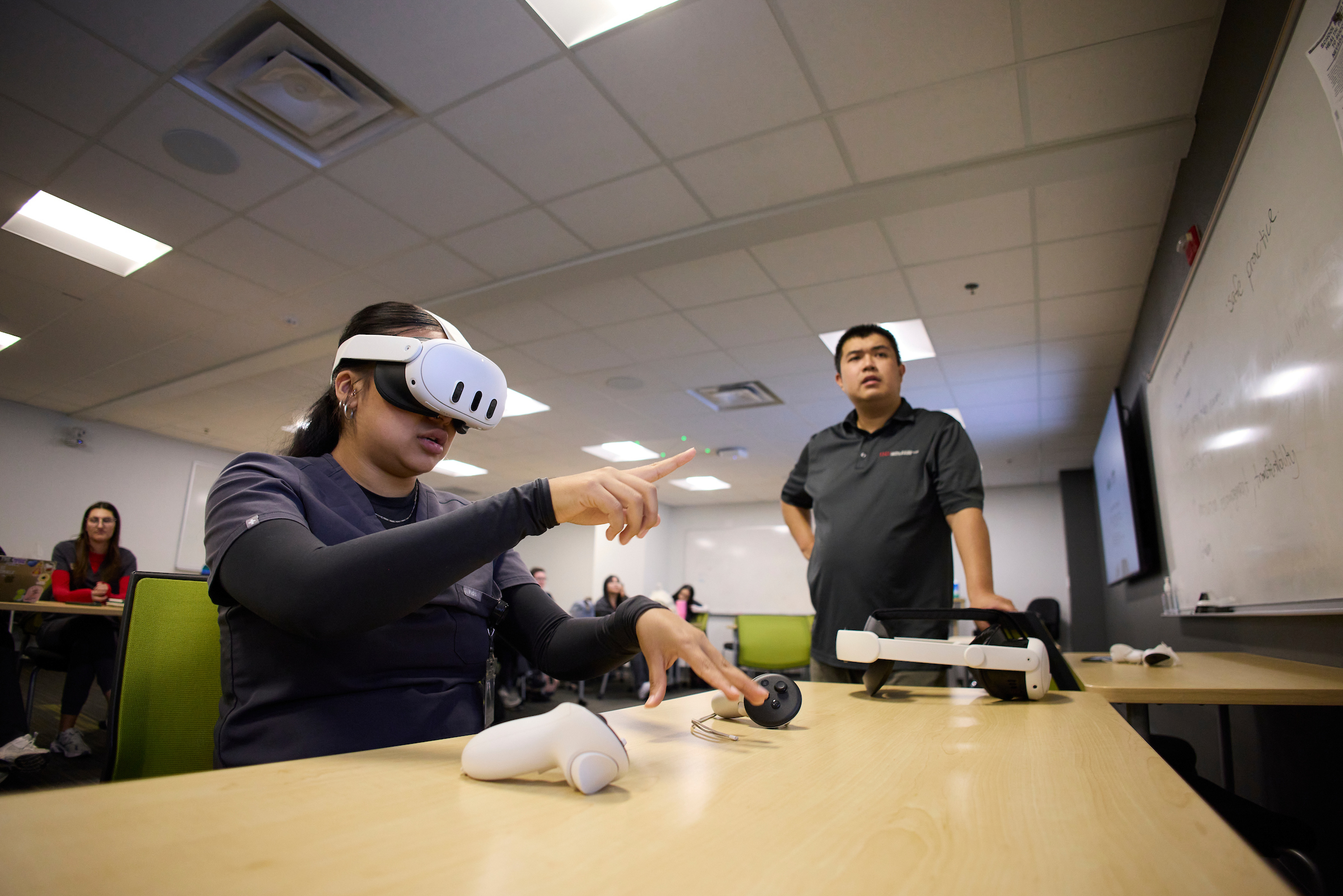 Student performing occupational therapy exercise with a virtual reality headset.