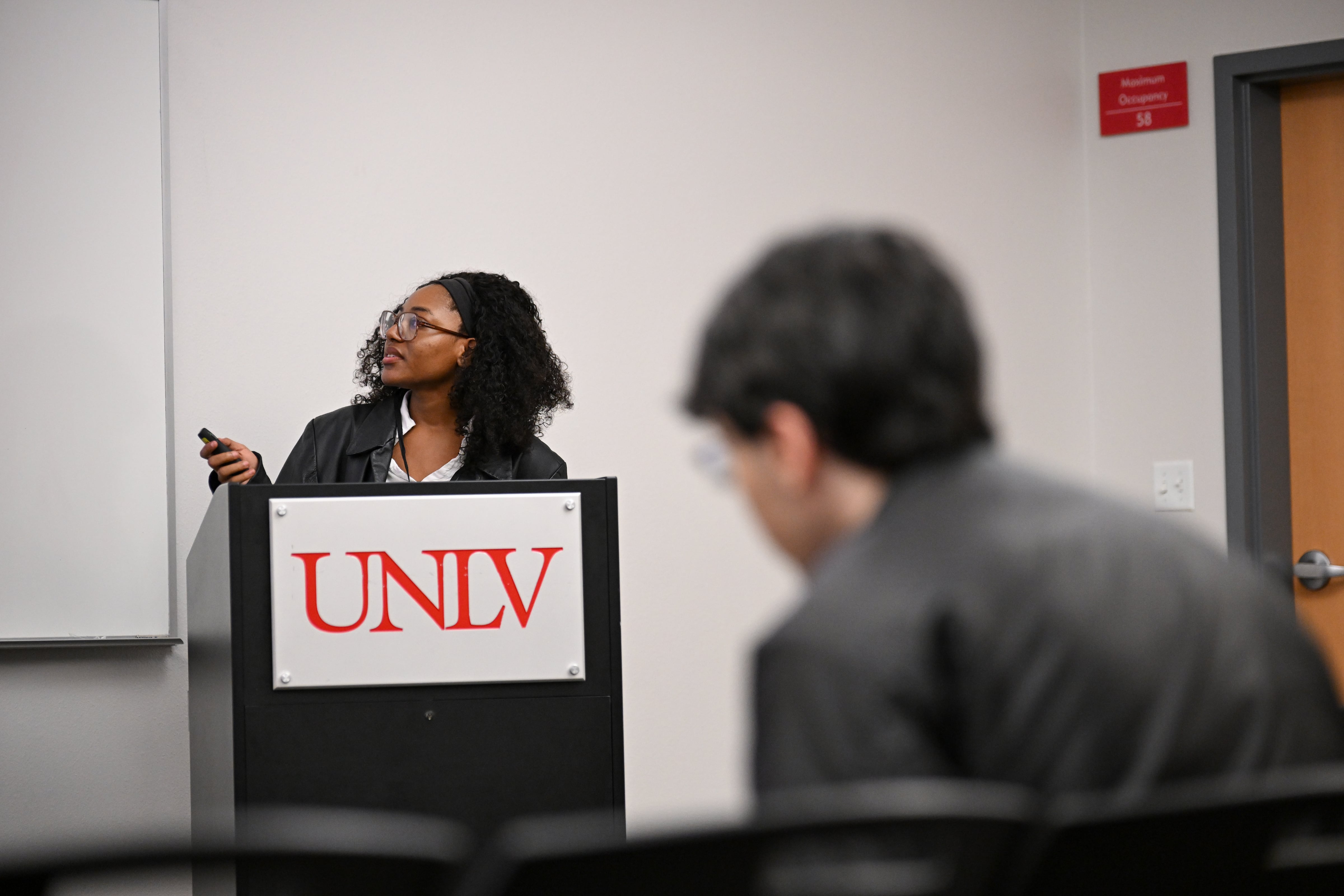 Presenter is speaking at a podium