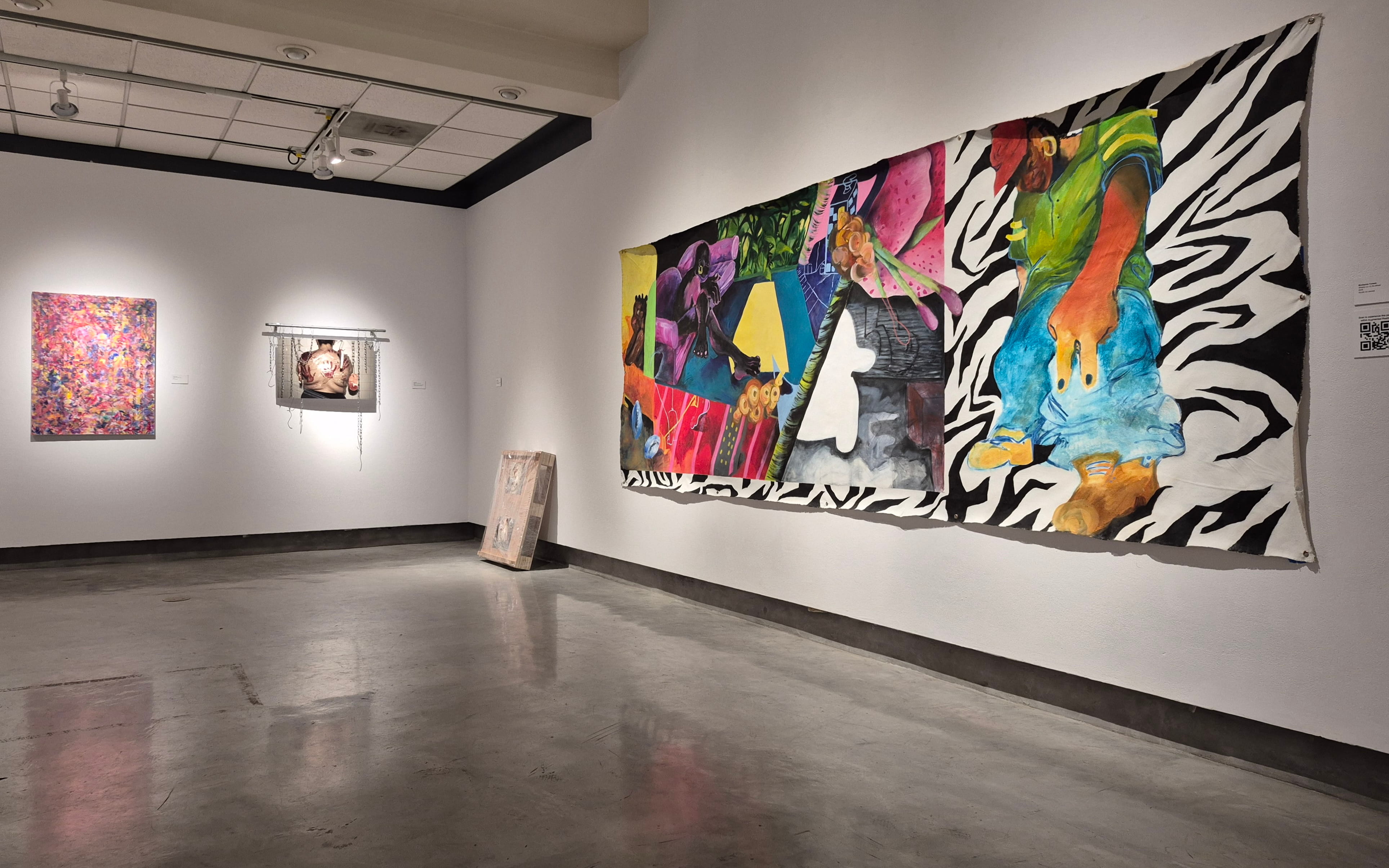 Art Display with paintings on the walls in a corner