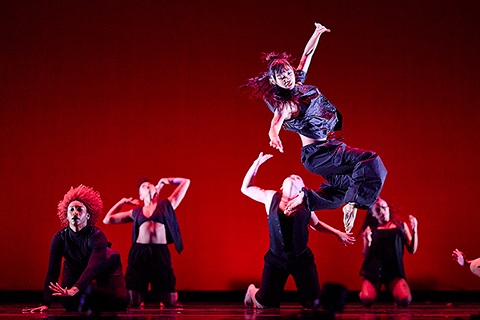 Several students performing a dance