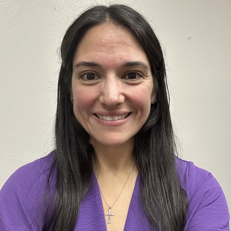 Christina Reyman in a purple blouse