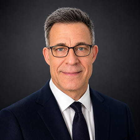 Photo of Marc Glasser in a suit