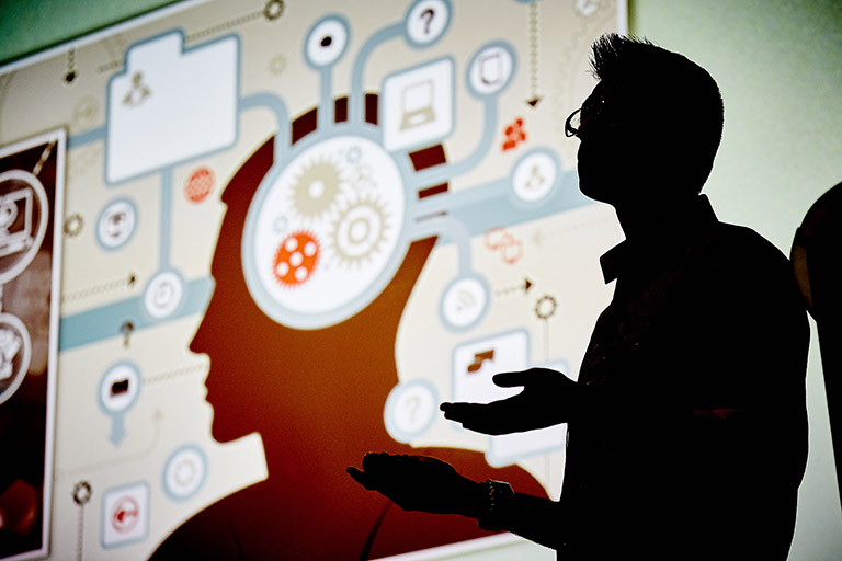 Silhouette of speaker during a presentation