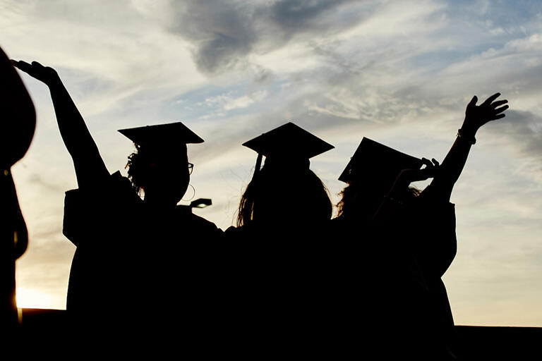 silhouette of graduates