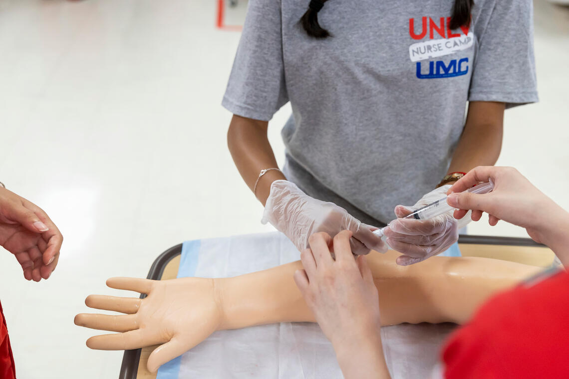 A person administrating a shot.