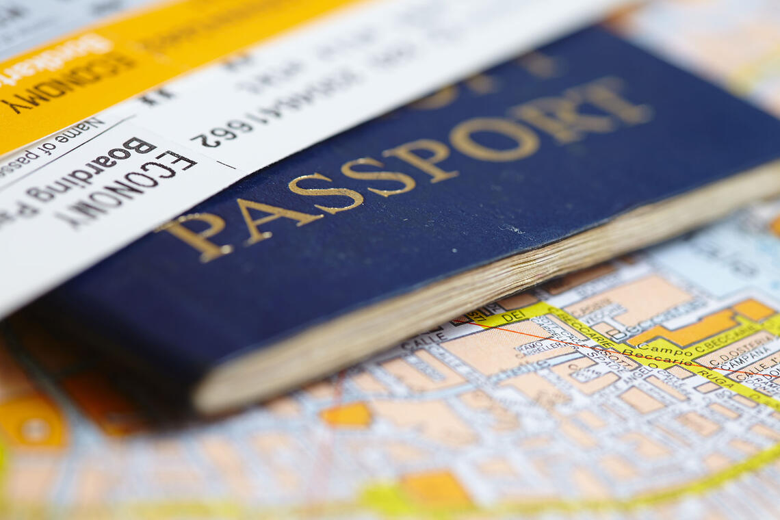 Close up shot of a passport on a map.