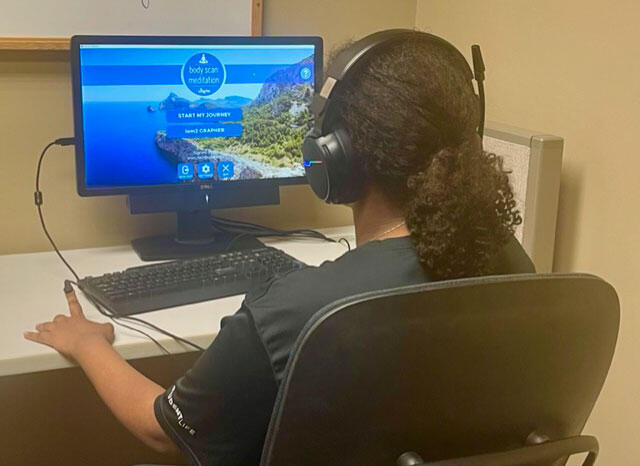 Girl typing at a computer