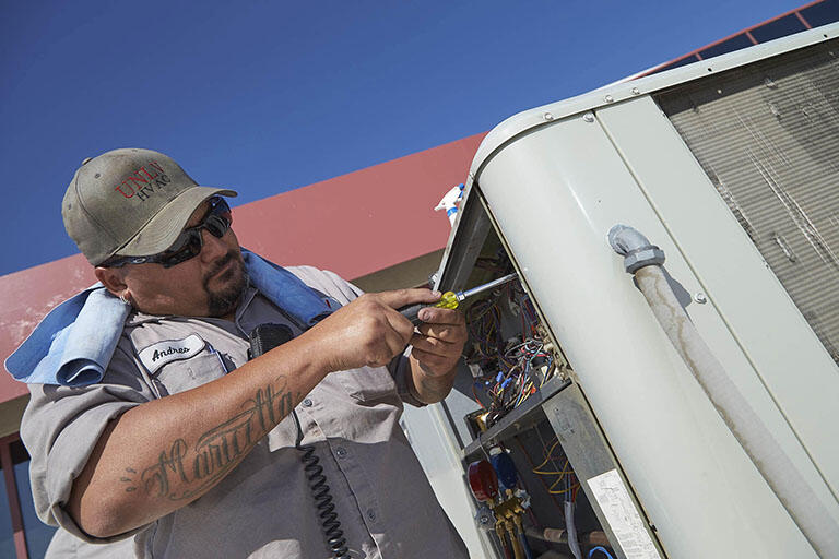 A mechanic working on a machine.