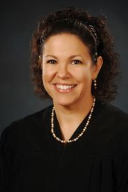 Headshot of Gloria M. Navarro