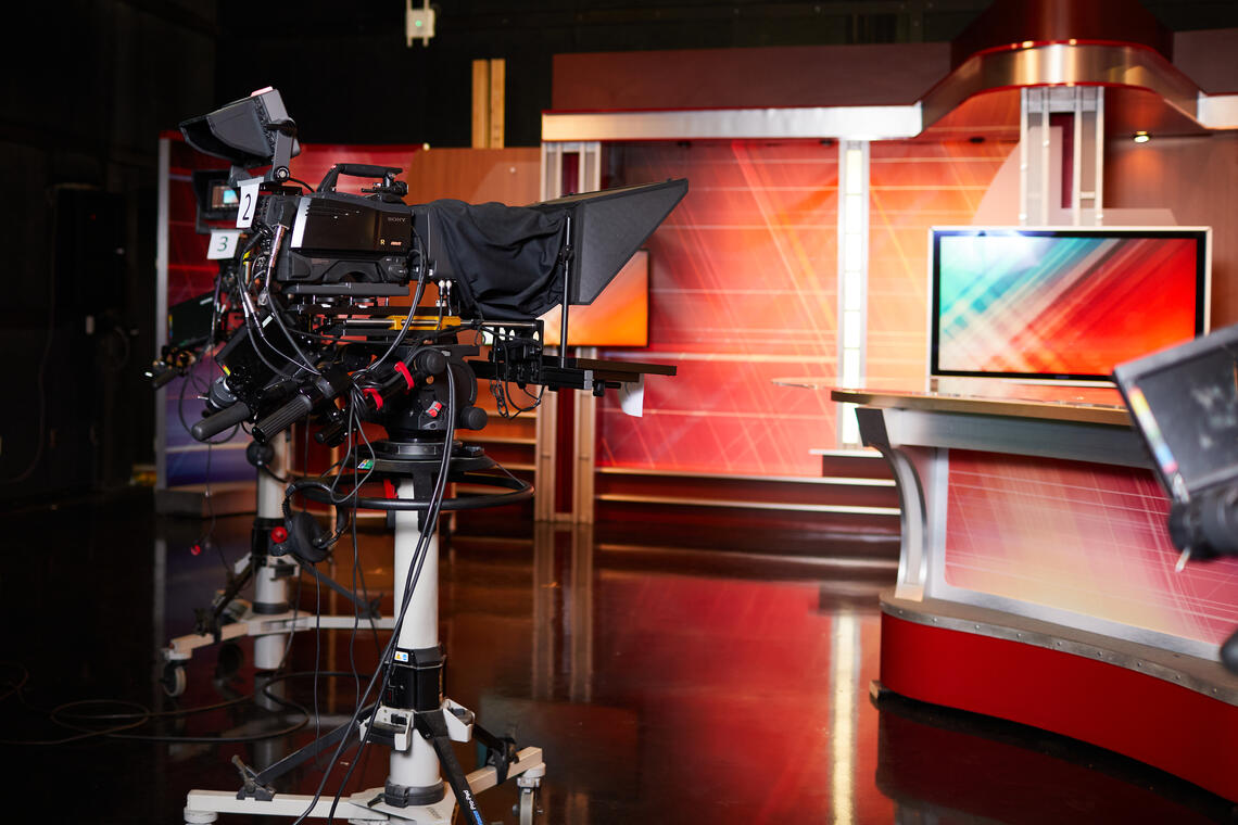 camera set up with wires hanging on the it