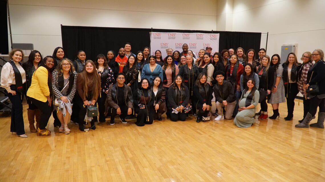 people gathered in a line for a photo
