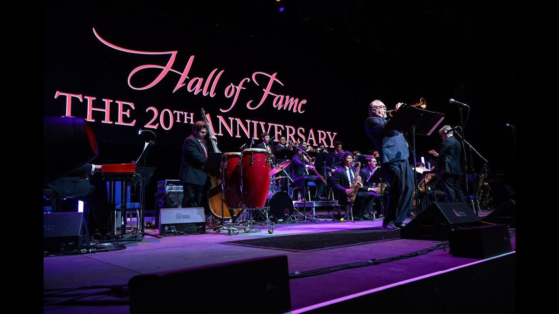 UNLV Jazz on stage at Fountainebleu Las Vegas, behind them the words: Hall of Fame 20th Anniversary