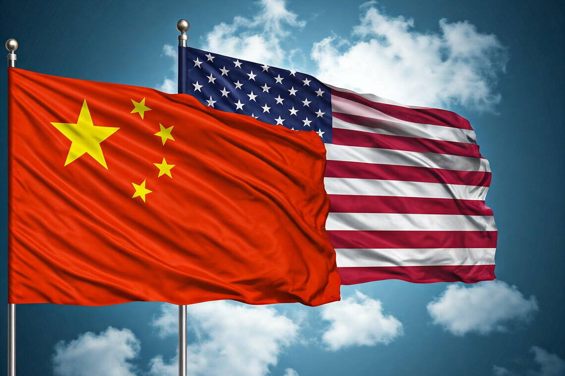 Two flags, a Chinese flag and an American flag, next to each other