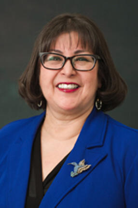 Headshot of Irene Bustamante Adams