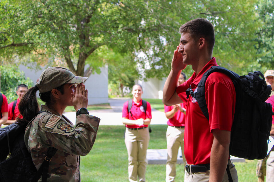 Two AFROTC recruits saluting each other