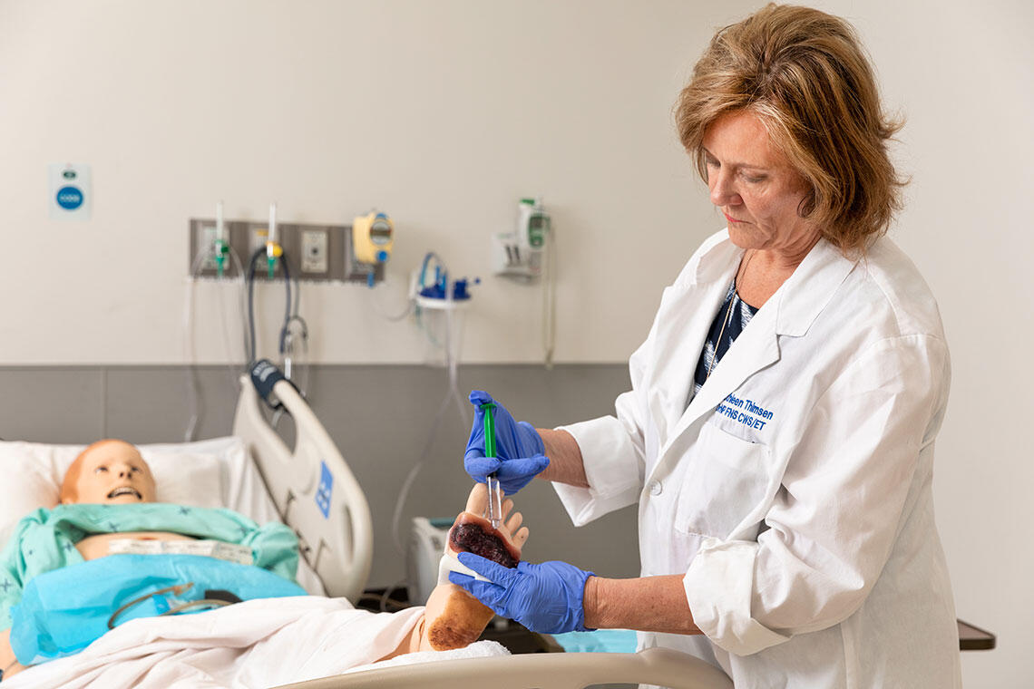 A doctor administrating a shot on a patient's foot