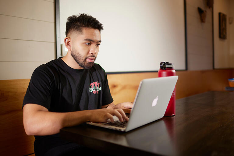Student working on a laptop