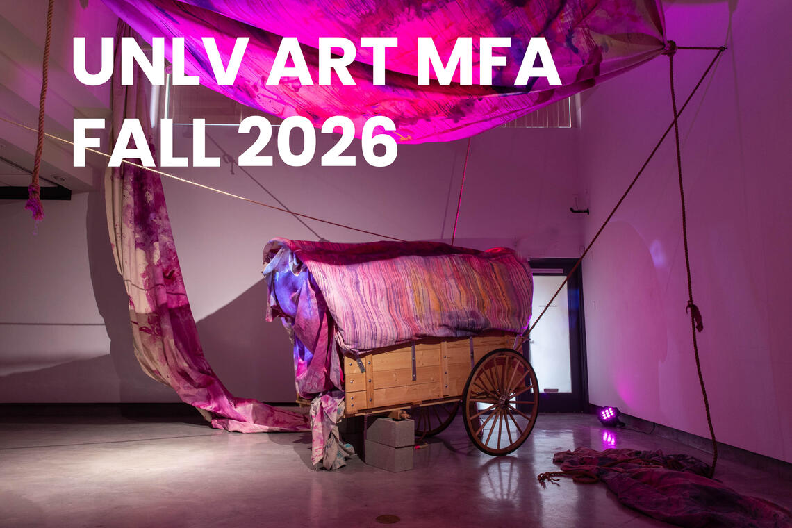 Photo of an exhibition featuring a horse driven wooden cart (no horse) and multi colored draperies and the text: UNLV ART MFA, Fall 2026