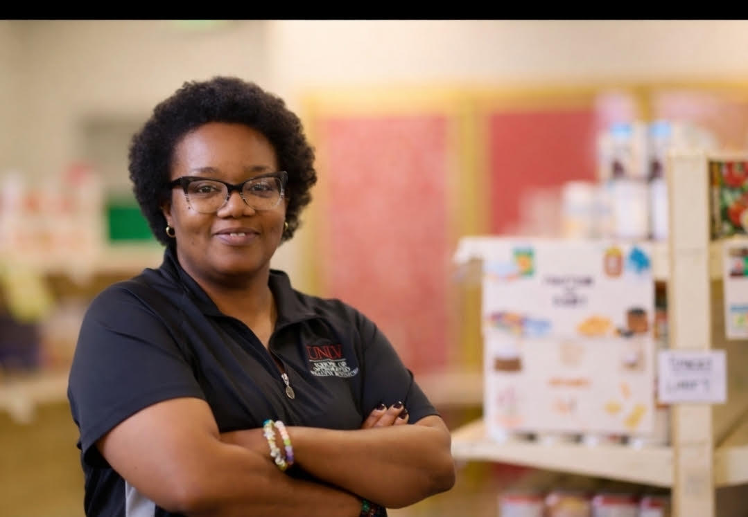 woman smiling in UNLV's food pantry