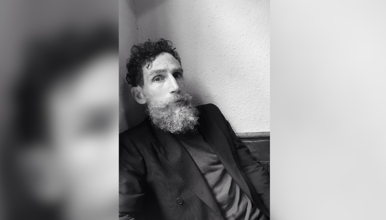 Headshot of Brock Norman Brock, man with beard.