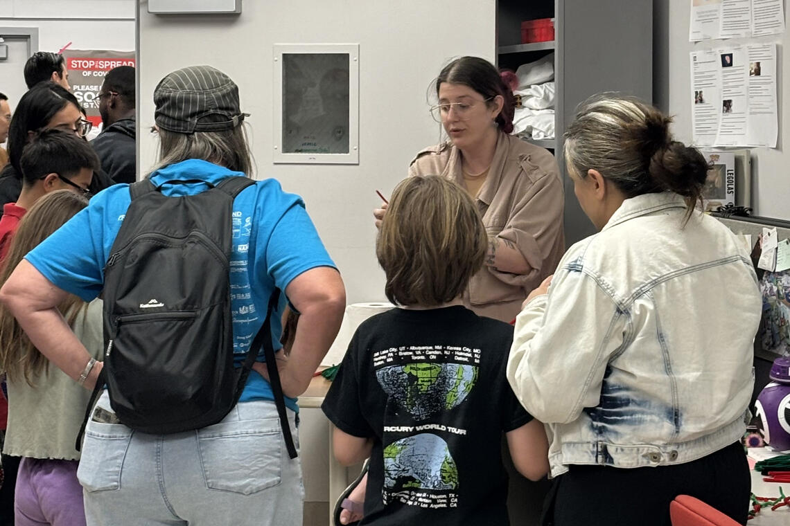 People listening to a speaker