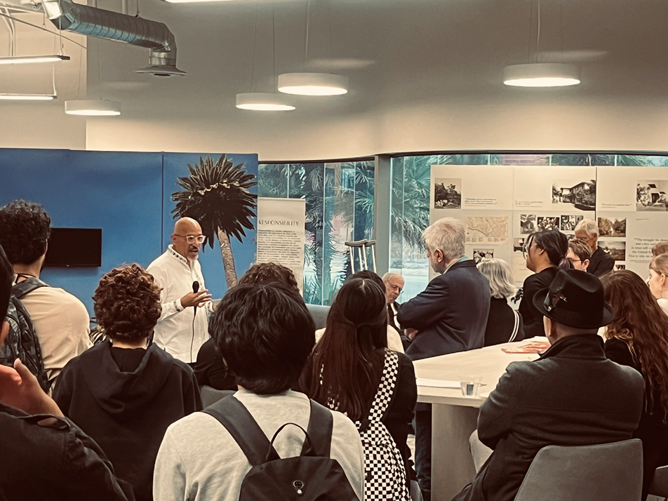 The Honorary Consul of the Republic of Germany Rayan Lower, author and professor Roberto Lovato and the chair of the Department of Political Science Dr. David Fott talked to guests at the opening reception of the Thomas Mann exhibit.