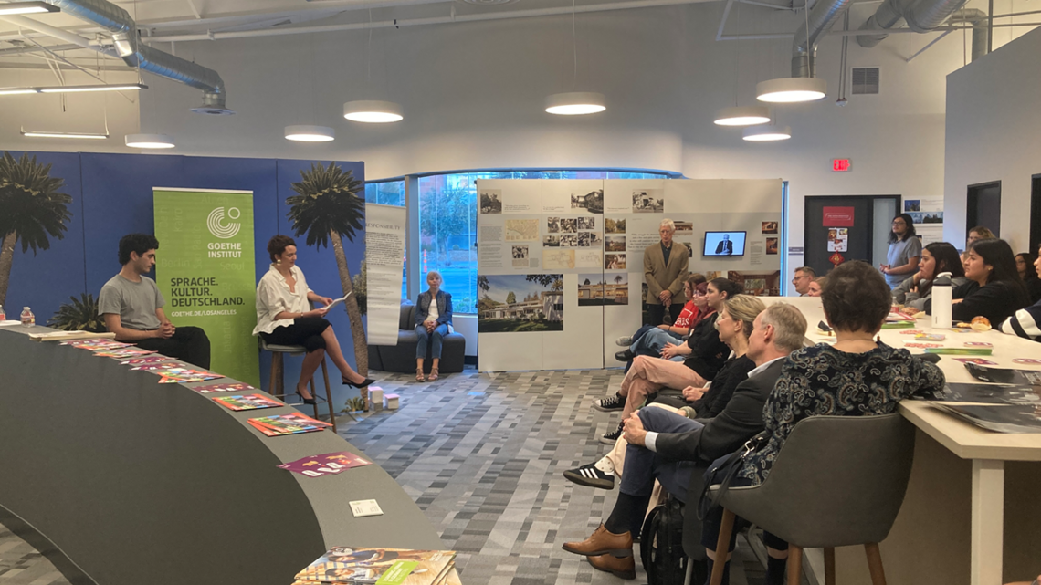 At the first stop of their trip through the United States, the two emerging authors from Germany, Louise Kenn and Mücahit Türk, read from their texts at the Thomas Mann exhibit on March 3rd. Dr. Ralph Buechler talked about Thomas Mann, a German writer who had also spent years of his life on the road.