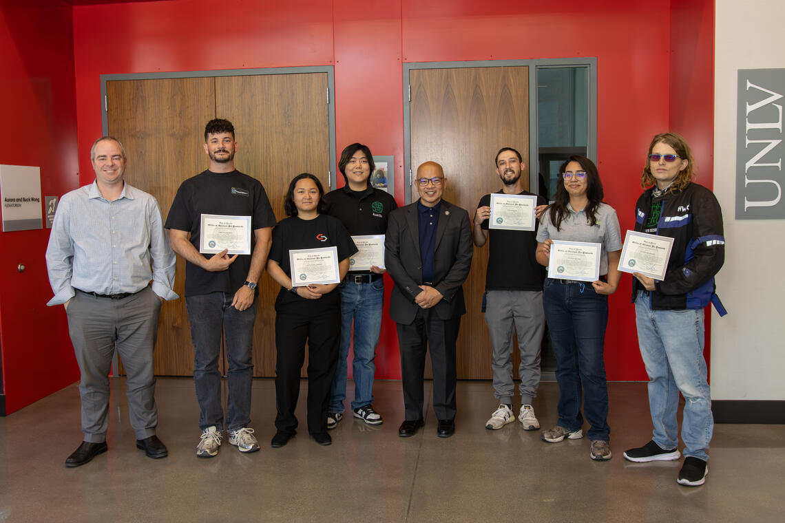 Representative from Governor's Office presents UNLV students with certificates of recognition
