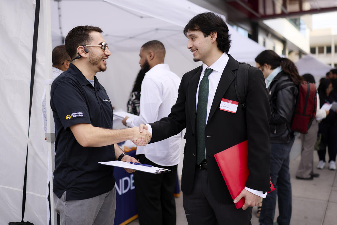 Two people shaking hands