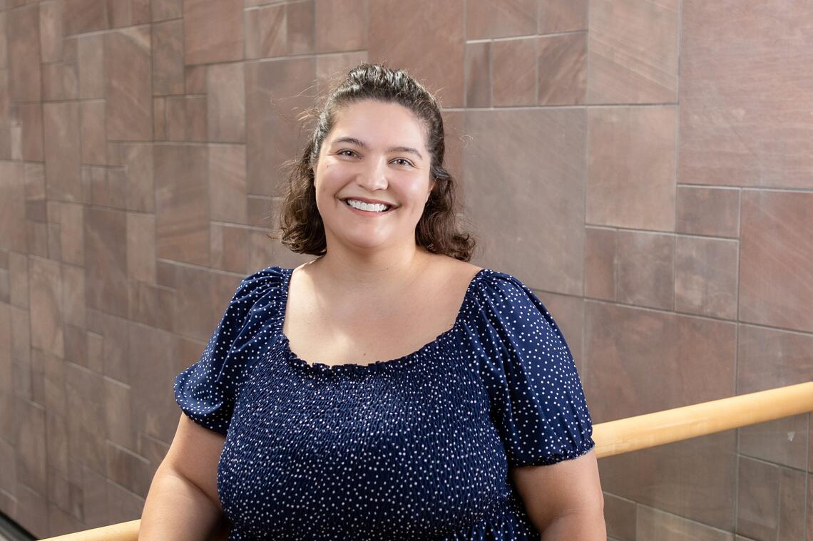 Graduate Student Poses for Photo
