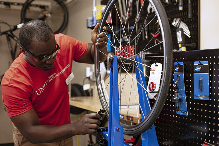 A man working on a bike.
